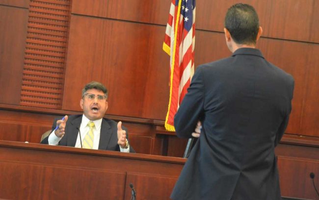 Jo Sesta during his encounter with Assistant State Attorney Jason Lewis today. (© FlaglerLive)