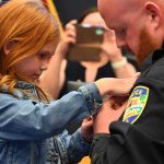 7-year-old Sydnee Groth, Shane Groth's niece, pinned the Lieutenant's insignia on her uncle at a ceremony before the Bunnell City Commission on May 13. (© FlaglerLive)