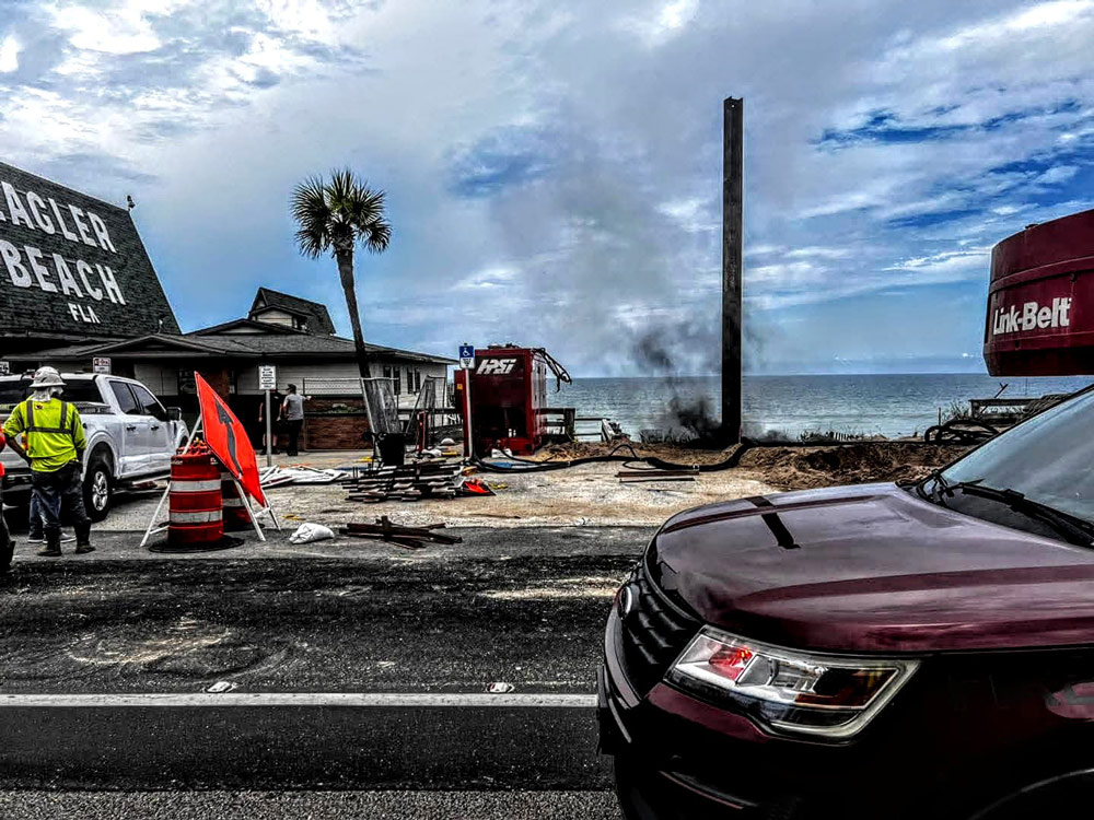The scene of the incident south of the pier this afternoon soon after the beam struck a power line. Vern Shank, the Flagler Beach DJ, was on the air when power went off and he ran outside, taking that picture soon after. “That’s kind of like the ail end of the smoke coming out," he said.