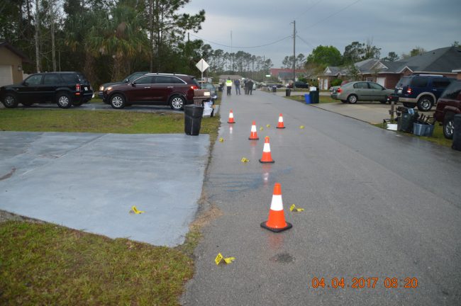 The scene this morning after shell casings had been identified on Plainview Drive, in the 160 Block, opposite 160 and 162, the two houses targeted by bullets. A bullet entered the bedroom of a resident at 162, and other bullets struck vehicles parked in front of 160. 