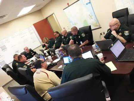 Flagler County Sheriff Rick Staly, at the head of the table, with his command staff at this morning';s briefing. (Facebook)