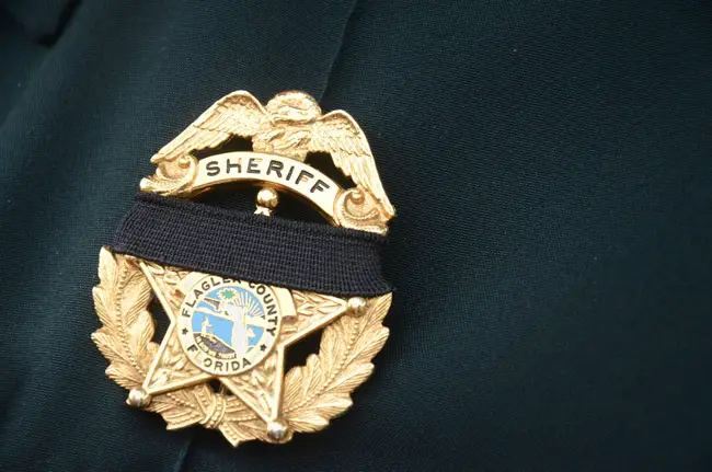 The Flagler County Sheriff holds its annual Law Enforcement Memorial ceremony, this year starting with a candlelight vigil at the Flagler County Courthouse, then walking to the Sheriff's Operations Center. See below. (© FlaglerLive)