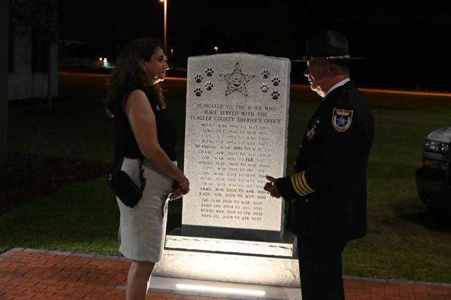 Circuit Judge Rose Marie Preddy, who sits in Putnam County court, with Sheriff Staly in front of the K-9 memorial, after Wednesday's ceremony. (© FlaglerLive)