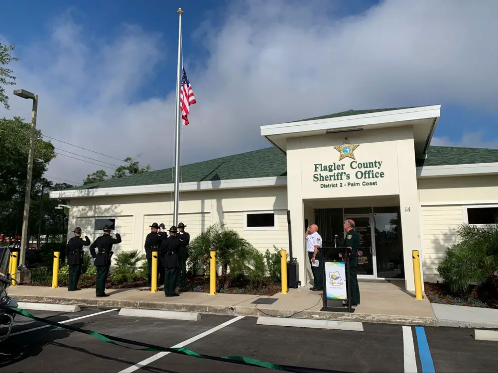 Sheriff Rick Staly, by the [podium, during the flag-raising in front of the Sheriff's Office's new Palm Coast Precinct this morning. (© FlaglerLive)