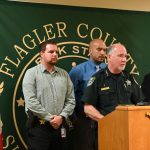 Sheriff Rick Staly announcing the charge against Robert Hill today with the detectives who worked the case. From left, Gabe Fuentes, Augustin Rodriguez, and the lead detective, Sarah (© FlaglerLive)