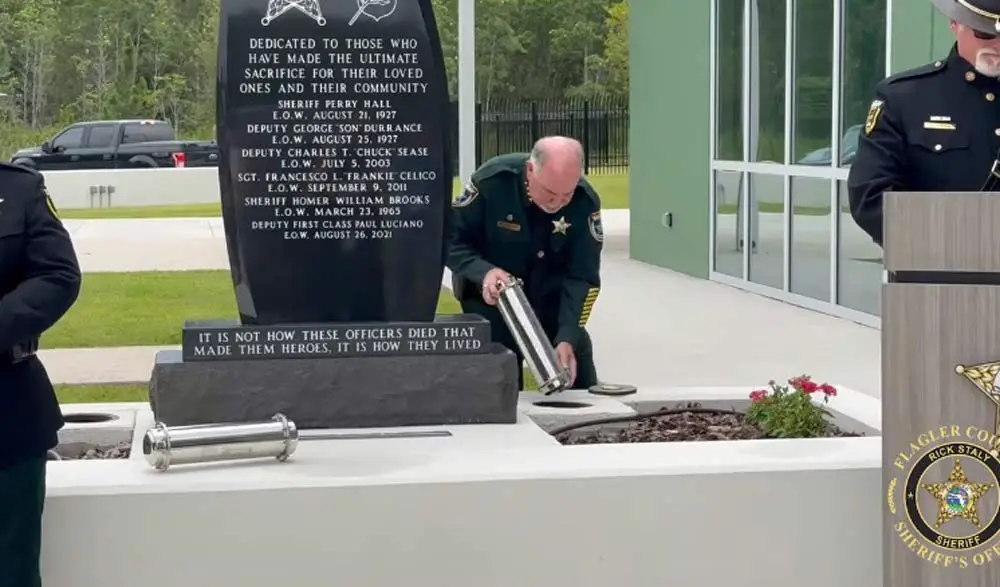 The sheriff entombs one of the time capsules, which are to be opened in 2067 and 2072. (Still from FCSO video)