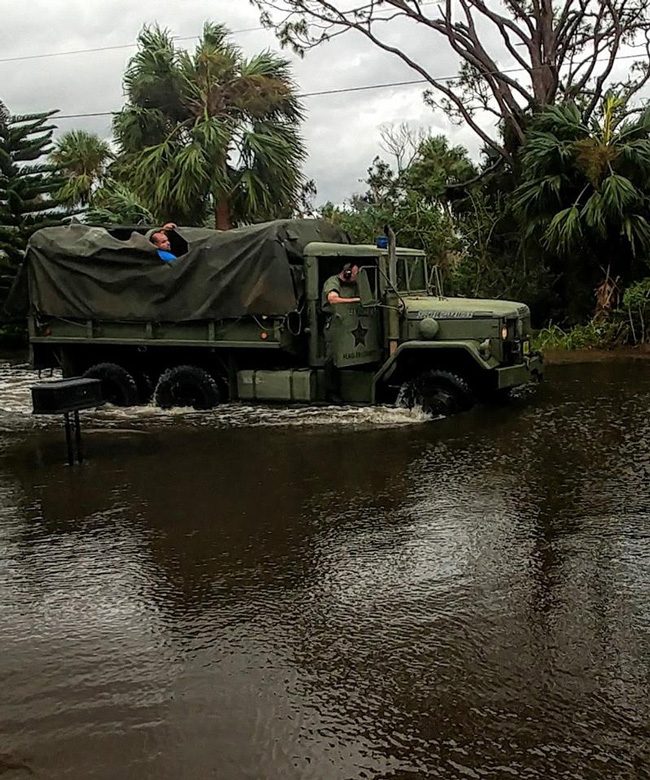 One of two 'Deuce and a half,' military surplus trucks the sheriff's office sent out this morning to Flagler Beach to check on stranded residents, an experience that made one resident's day--before he himself decided to do likewise, in a kayak. (Scott Spradley for FlaglerLive)