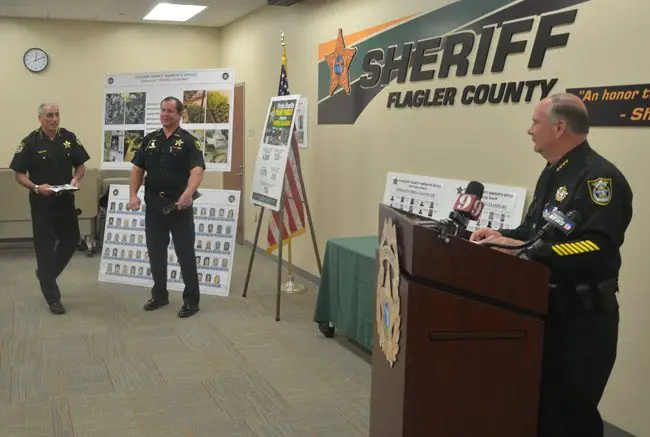 Sheriff Rick Staly, right, preparing to address the press today with Sheriff Mike Chitwood and Sheriff Gator Deloach. (© FlaglerLive)
