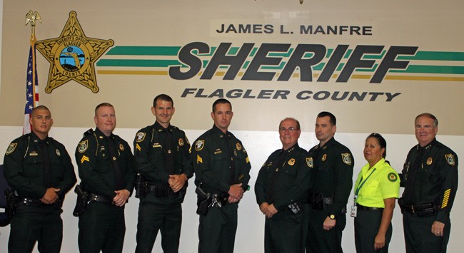 From left, Detention Deputy Ronald Ward, Sergeant Jonathan Welker, Corporal Ryan Emery, Sergeant Jason Neat, Sheriff James L. Manfre, Chief Deputy Jeff Hoffman, Joann Ramos and Undersheriff Rick Staly, who retires Friday.