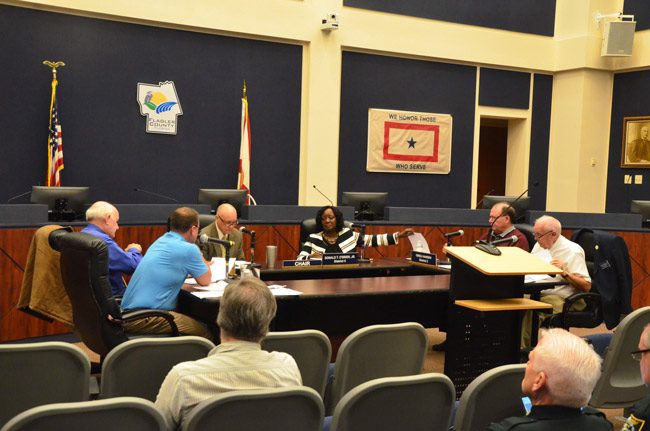 Sally Sherman, the deputy county administrator, sat with county commissioners during a special meeting this morning. Commissioners opted not to sit on the dais. (© FlaglerLive)