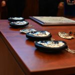 New shields for new Bunnell Police Department recruits sworn in on Feb. 28. But the city will contract with the Flagler County Sheriff's Office to conduct its major crimes investigations. (© FlaglerLive)