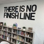 There Is No Finish Line: the sign used to hang in Superintendent LaShakia Moore's office before she got the top job, and now hangs in the administrative offices at Flagler Palm Coast High School. The line has been the theme of school officials' reaction to the district returning to an A. (© FlaglerLive)