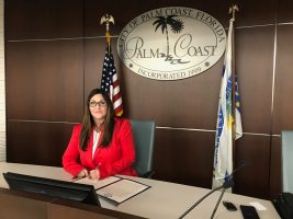 Mayor Milissa Holland signing the emergency declaration this afternoon. (Palm Coast)