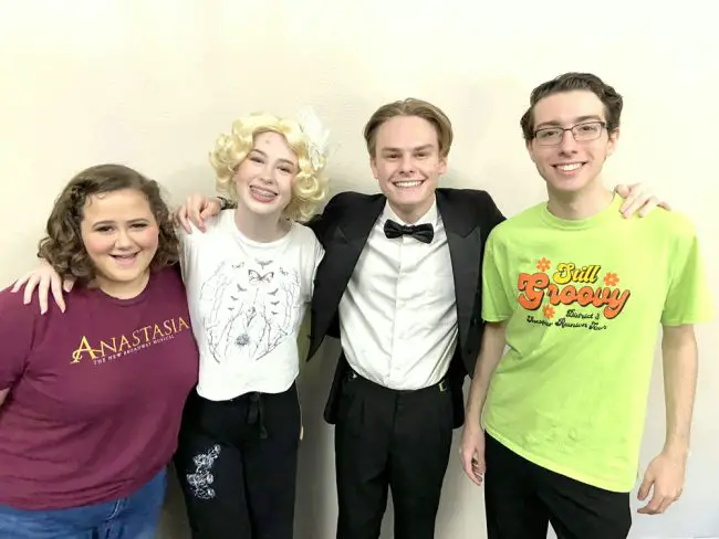 The cast of the Flagler Palm Coast High School production of “Singin’ in the Rain” includes, from left: Molly Maresca as Kathy Selden, Charlotte Fletcher as Lina Lamont, Seth Kirk as Don Lockwood and Aidan Wise as Cosmo Brown. FlaglerLive photo