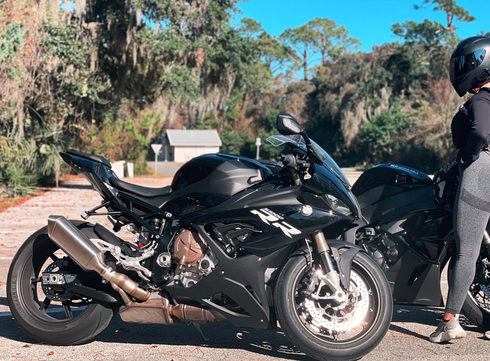 The 22-year-old victim, a competitive racer, posing with her motorcycle in a self-portrait she posted on Facebook in December. 