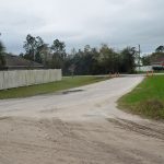 Slow Way in Seminole Woods is only a few dozen feet long and connects to a dirt, county road. (© FlaglerLive)