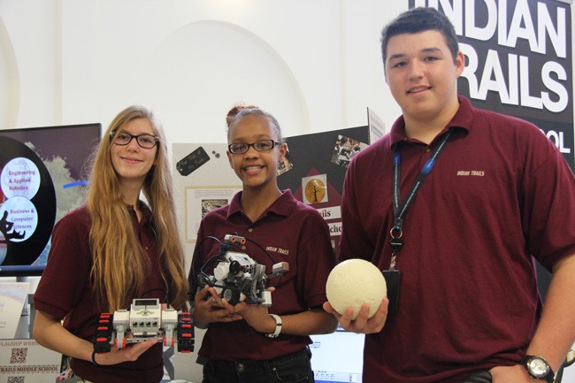 Samantha Lauria, 14, Rose Minaya, 13, and Justin Cestare, 14, were represented the Indian Trails Middle School robotics flagship program at last week's symposium. (© FlaglerLive).