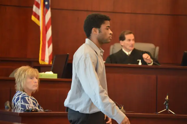 L'Darius Smith will get to walk, as he did off the witness stand this morning, with Circuit Judge Dennis Craig in the background. (c FlaglerLive)