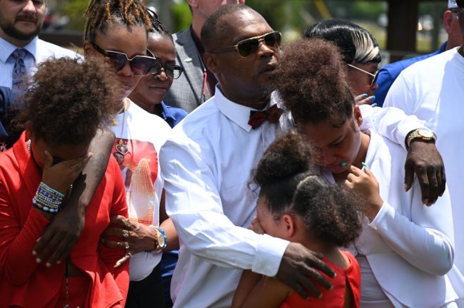 Keith Smith, Noah Smith's father, with his family at today's press conference. (© FlaglerLive)