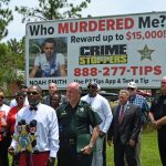 Keith Smith, father of 16-year-old Noah Smith, the Flagler Palm Coast High School student slain on a Bunnell street last January, addressing media during a press conference this afternoon on the billboarded offer of a $15,000 reward for information leading to the arrest of Smith's killer. (© FlaglerLive)