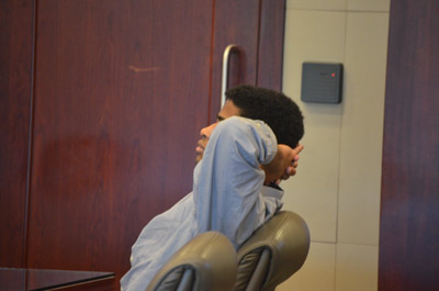 After the verdict Smith stretched but did not get up when the jury filed out: he was the only person sitting down in the courtroom. (© FlaglerLive)