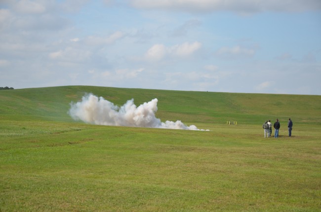 The smoke from the smoke bomb is released. Click on the image for larger view. (© FlaglerLive)