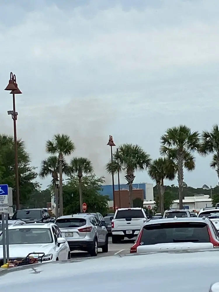 Smoke billowing behind FPC, from the burn site, on April 14. (© Contributed to FlaglerLive)
