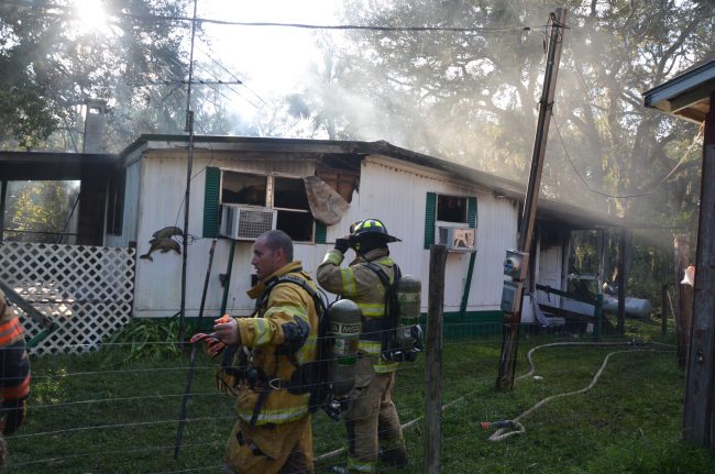 Little more but smoke in the late-afternoon sun. Click on the image for larger view. (c FlaglerLive)