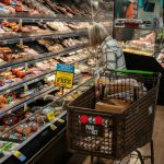 A shopper looks at a meat display at a supermarket. Some 42 million Americans rely on SNAP benefits to put food on the table. Robert Nickelsberg/Getty Images News
