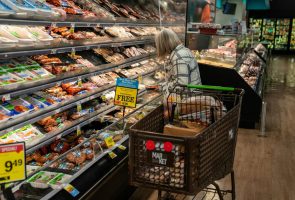 A shopper looks at a meat display at a supermarket. Some 42 million Americans rely on SNAP benefits to put food on the table. Robert Nickelsberg/Getty Images News