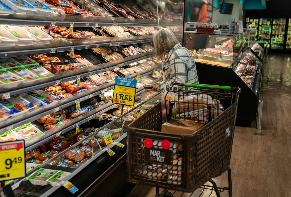 A shopper looks at a meat display at a supermarket. Some 42 million Americans rely on SNAP benefits to put food on the table. Robert Nickelsberg/Getty Images News