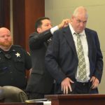 David Snelgrove getting prepared for today's trial--his third penalty phase on two murder convictions dating back two decades--with his attorney, Michael Nielsen. (© FlaglerLive)