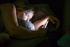 Social media use before bedtime can be stimulating in ways that screen time alone is not. Adam Hester/Tetra Images via Getty Images