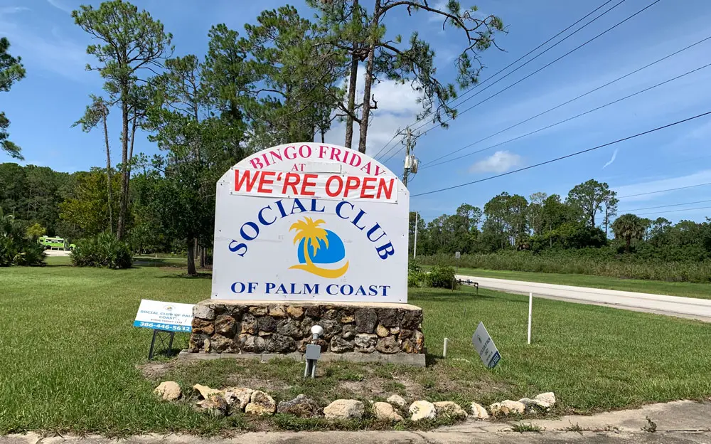 The Social Club of Palm Coast's secretary was defensive and inaccurate as she told the County Commission that the superspreader could have happened anywhere. (© FlaglerLive)