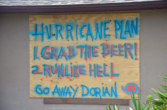 A boarded up house's message to Hurricane Dorian at the south end of Flagler Beach, near the Intracoastal, a neighborhood battered by Irma's floodwaters two years ago. (© FlaglerLive)