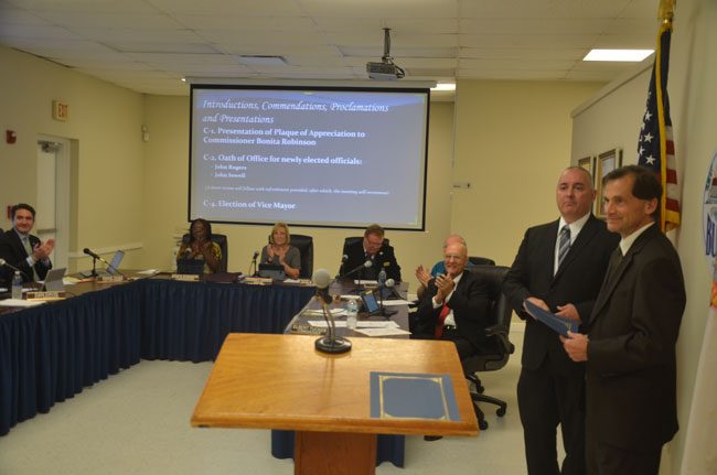 John Sowell and Judge Dennis Craig to the right just before tonight's swearing in at the Bunnell City Commission. (c FlaglerLive)