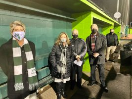 The evening's speakers in the dugout. Click on the image for larger view. (Flagler Schools)