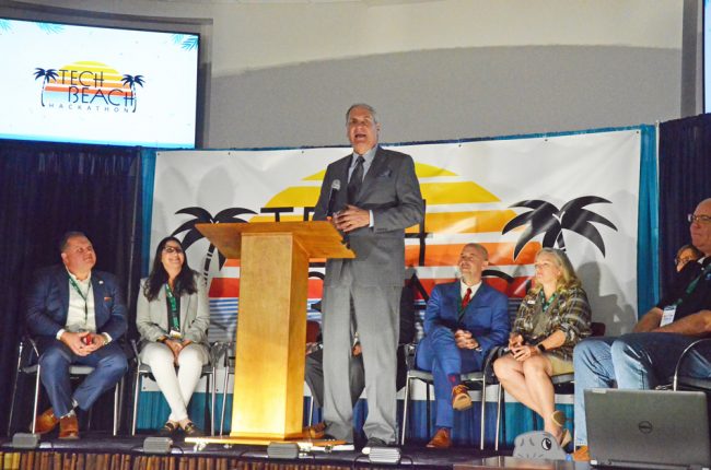 Daytona State College President Tom LoBasso and University of North Florida president David Szymanski, state Department of Education Chancellor Jacob Oliva, the former Flagler superintendent, and several local elected city officials, including of course Holland.