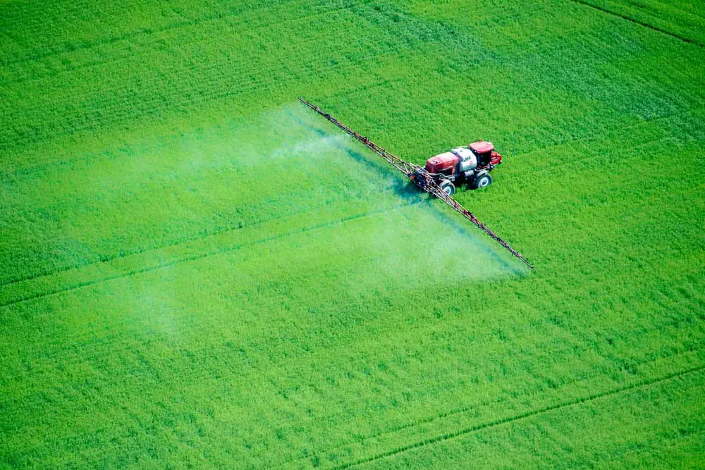 Spraying from either a ground-based vehicle or an airplane is a common method for applying pesticides. (Edwin Remsburg/VW Pics via Getty Images)