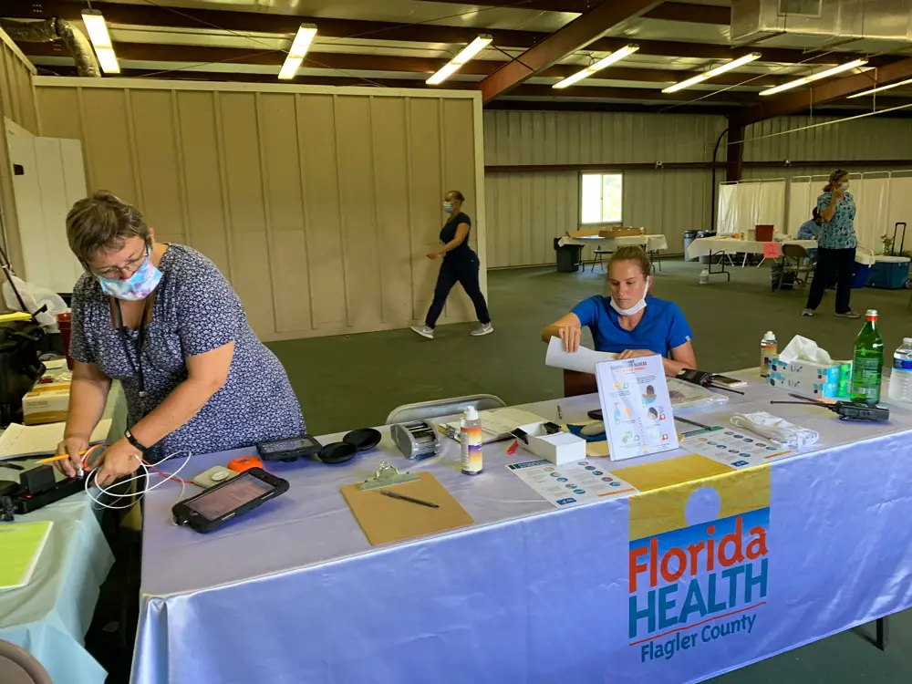 Flagler Health Department staffers setting up a new covid-19 testing location at Cattleman's Hall at the county fairgrounds earlier this week. The location is open three days a week, six hours a day. (DOH)