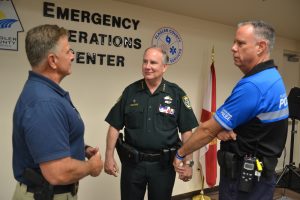 Sheriff Rick Staly, center, with Flagler Beach Police Chief Matthew Doughney, right, and Bunnell Police Chief Tom Foster during the Hurricane Irma emergency two years ago. (© FlaglerLive)