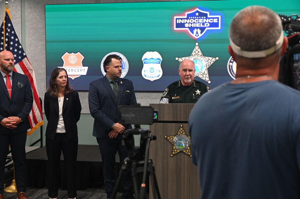 Sheriff Rick Staly at this afternoon's press conference with, among others, Detective Joseph O'Barr and Assistant State Attorney Melissa Clerk. (© FlaglerLive)