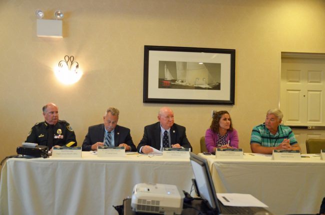 Speakers today included, from left, Sheriff Rick Staly, State Attorney R.J. Larizza, Public Defender Jim Purdy, Family Life Center Executive Director Trish Giaccone, and Stewart Marchman Act therapist Lamar Sunny Donaldson. Click on the image for larger view. (© FlaglerLive)