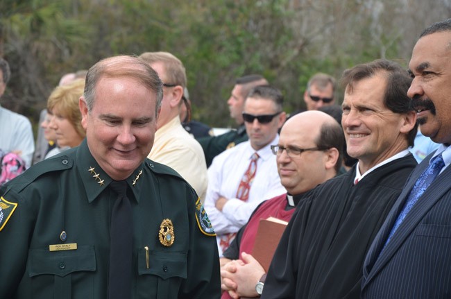 Undersheriff Rick Staly, left, at Sheriff Jim Manfre's inauguration in January 2013, with Judge Dennis Craig and Sid Nowell, the sheriff's attorney. (© FlaglerLive)
