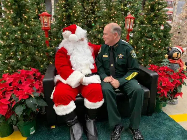 Sheriff Rick Staly thanks Santa, who may or may not have been a county commissioner. (FCSO)