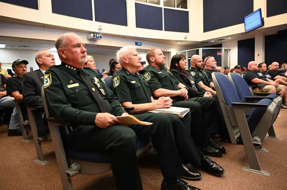 Sheriff Rick Staly and some of his top staff before speaking Monday evening. (© FlaglerLive)