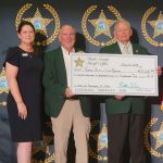 Sheriff Staly presenting the employee donation to Maria Knapp, FSYR Executive Vice President, and Bobby McCallom, Levy County Sheriff and FSYR Board Chair. (FCSO)