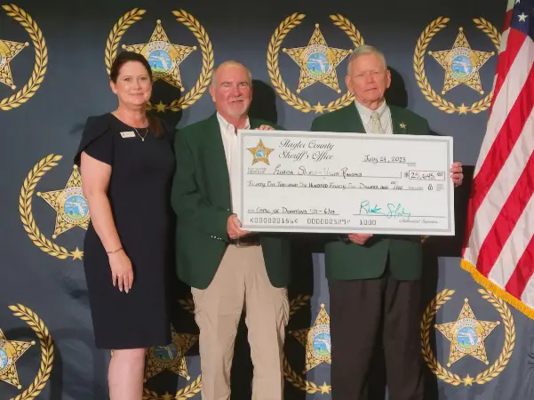 Sheriff Staly presenting the employee donation to Maria Knapp, FSYR Executive Vice President, and Bobby McCallom, Levy County Sheriff and FSYR Board Chair. (FCSO)