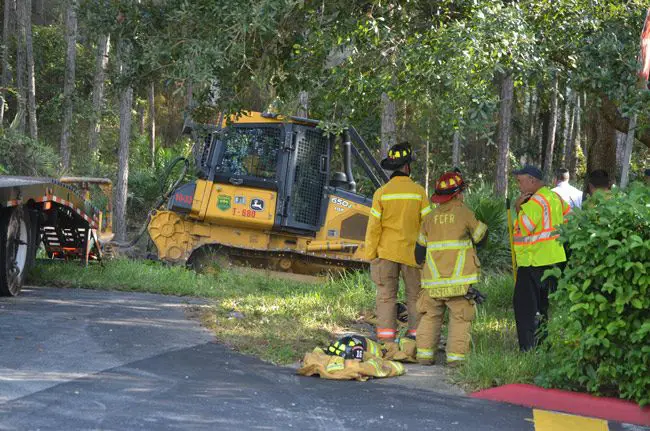 Gov. Scott  had vetoed $1.57 million for state firefighters, including employees who fight forest fires, who are frequently deployed in Flagler, as was the case above on a wildfire in Palm Coast. (© FlaglerLive)
