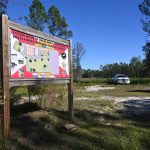 The site of the Florida State Guard training facility supposed to be built in Bunnell. A year after the groundbreaking, it was fallow land, good for a rest for a construction worker at the SMA residential facility project that broke ground nearby on Nov. 18, when this picture was taken, and that has advanced rapidly. (© FlaglerLive)